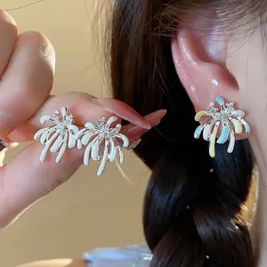 Close-up detail of colorful fireworks stud earrings with zircon inlay and enamel finish