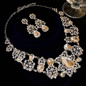 Elegant silver-tone rhinestone flower and teardrop jewelry set for formal occasions