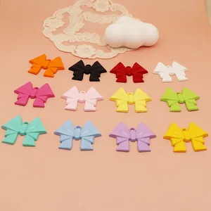 Assorted colorful spray-painted alloy bow pendants for sweet DIY jewelry and bag charms