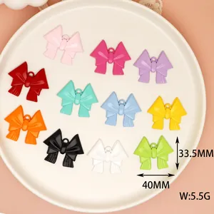 Detailed view of colorful alloy bow charms with 40mm x 33.5mm dimensions and weights