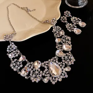 Detailed macro view of elegant flower and teardrop rhinestone necklace and earring set