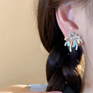 Detailed close-up view of colorful enamel firework stud earrings featuring zircon accents
