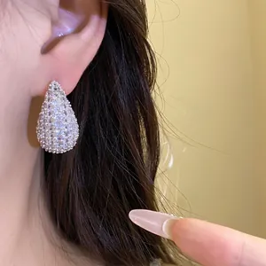 Sparkling zircon waterdrop stud earrings for women with a luxury aesthetic and silver needles