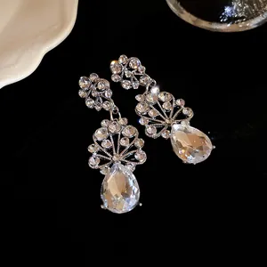 Elegant silver crystal flower teardrop dangle earrings shown in a detailed close-up view