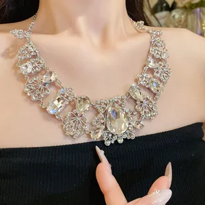 Close-up of elegant necklace featuring rhinestone flowers and teardrop crystals