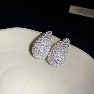 Detailed close-up of sparkling zircon water drop stud earrings with micro-pave stones