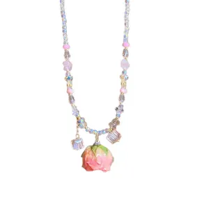 Sweet handmade necklace with preserved pink rose pendant and iridescent glass beads.