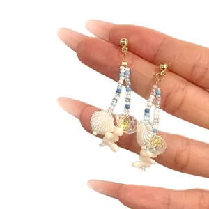 Handcrafted bohemian shell and bead drop earrings for elegant beach vacation style