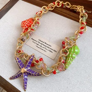 Close-up of beaded necklace with colorful starfish and seashell charms