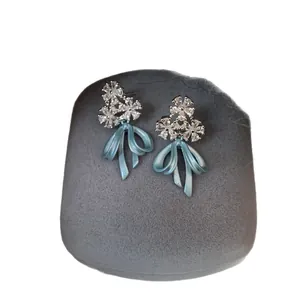 Elegant ice blue bow drop earrings with sparkling crystal flower clusters for women