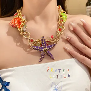 Close-up of vibrant enamel starfish necklace with gold chain and colorful acrylic beads