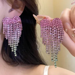 Exquisite close-up of pink and green gradient rhinestone heart tassel earrings detail