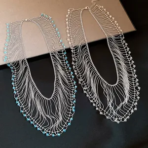 Detailed view of multi-strand crystal bead fringe necklaces in blue and clear.