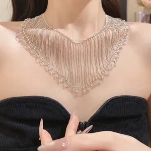 Detail view of a shimmering crystal bead fringe collar necklace worn by a model.