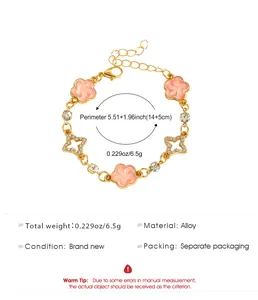 Spécifications du bracelet trèfle rose et étoile en strass avec indications de poids et taille