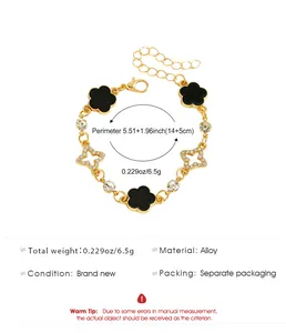 Élégant bracelet en alliage doré avec trèfles noirs et breloques en forme d'étoiles diamantées