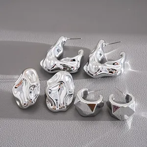 Macro view of 6-piece silver metallic geometric irregular earring set for women