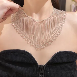 Elegant silver beaded fringe tassel necklace with intricate lace-like patterns on model