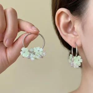 Elegant S925 silver needle hoop earrings with sweet light green resin flowers