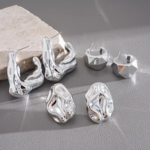 Detail view of a six-piece silver metallic earring set with irregular geometric designs