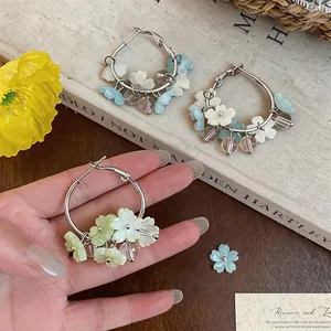 Elegant floral resin hoop earrings with silver pins for a sweet summer vacation look