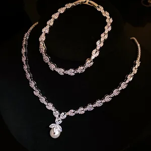 Elegant jewelry set featuring marquise zircon necklace with pearl pendant and bracelet
