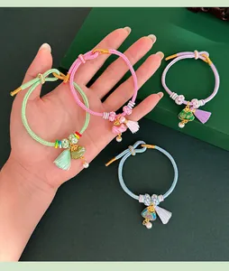 Handmade woven bracelet with Song brocade triangle charm and tassel for Dragon Boat Festival