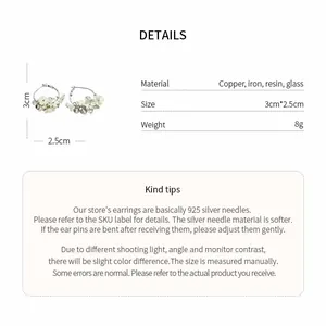 Detailed view of resin flower hoop earrings with size and material specifications.