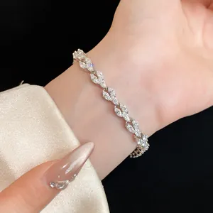 Close-up view of an elegant marquise-cut cubic zirconia leaf bracelet worn on a wrist.