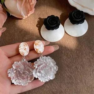 Elegant resort style resin floral drop earrings with translucent white flower petals