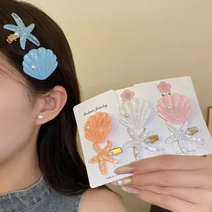 Detailed view of resin starfish and seashell hair clip set in various coastal colors.