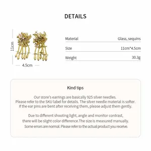 Close-up of glass sequin flower tassel earrings showing product dimensions and weight