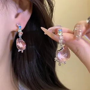 Detailed close-up showing sweet pink strawberry drop earrings decorated with colorful crystals