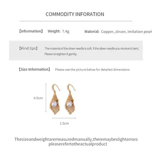 Detail view of hollow lace pearl earrings with 4.5cm height and copper material specs