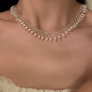 Close-up detail of French retro pearl beaded lace choker necklace worn on a model's neck