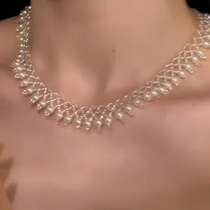 Detailed view of an elegant French vintage pearl beaded lace choker necklace for women