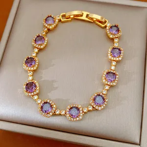 Detail view of a vintage gold-plated bracelet with purple zircons in a jewelry box