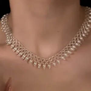 Detailed close-up shot showing the intricate pearl beaded lace design of this vintage necklace.