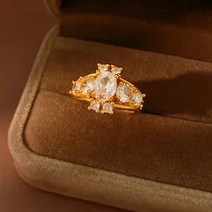 Macro detail of a vintage palace style gold plated ring with geometric oval zirconia stones