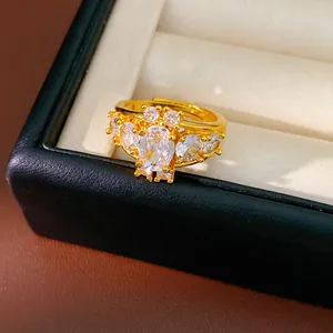 Close-up of vintage oval cubic zirconia gold ring in a luxury black jewelry box