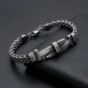 Close-up detail of a vintage stainless steel mesh bracelet with belt buckle plate design