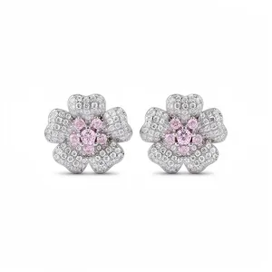 Elegant flower stud earrings with sparkling pink and white zircons in silver finish.