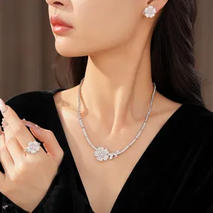 Detailed shot of sparkling zircon flower jewelry set including necklace, ring, and earrings