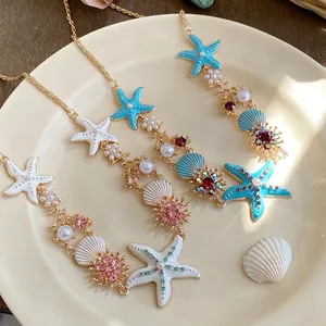 Close-up detailed view of summer starfish pearl necklace with vibrant sea-themed rhinestones