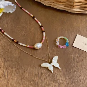 French style beaded necklace with pearl butterfly pendant and floral ring