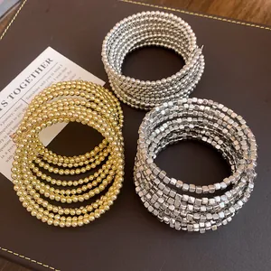 Elegant multilayer wrap bracelets with gold and silver beads for a retro look.