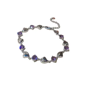 Elegant silver-toned heart bracelet featuring brilliant purple zircon stones for women