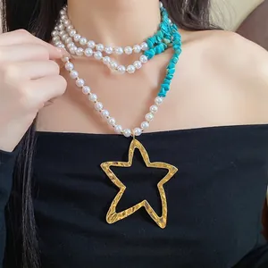 Elegant multi-layer pearl and turquoise beaded necklace with large gold star pendant