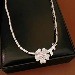 Exquisite close-up detail of a sparkling zircon flower pendant on a silver tennis necklace