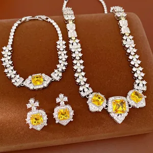 Close-up of luxury jewelry set featuring yellow square zircons with silver-tone finish